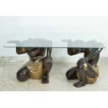 Asian Couch Table, with two wooden carved kneeling servants holding a glass top with rounded