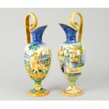 Pair of Urbino Jugs, Ceramic in classical shape with two scrolled handgrips and spout. Painted