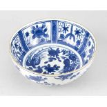 Blue and white chinese porcelain bowl, with field decoration at the inner border and birds on the