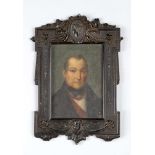 Ebonized Frame, with open work carving, in rectangular shape with garlands, faces and flowers,