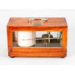 Seismograph, with paper scale and metal finger, in wooden casket with glass windows to be opened,