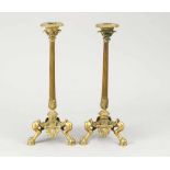 Pair of Restauration candle sticks, bronze cast with three legs, garlands and leaves, fluted central