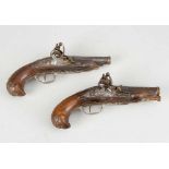 Pair of French Duel Pistols, flintlock technique with iron mounts and the barrel partly canted and