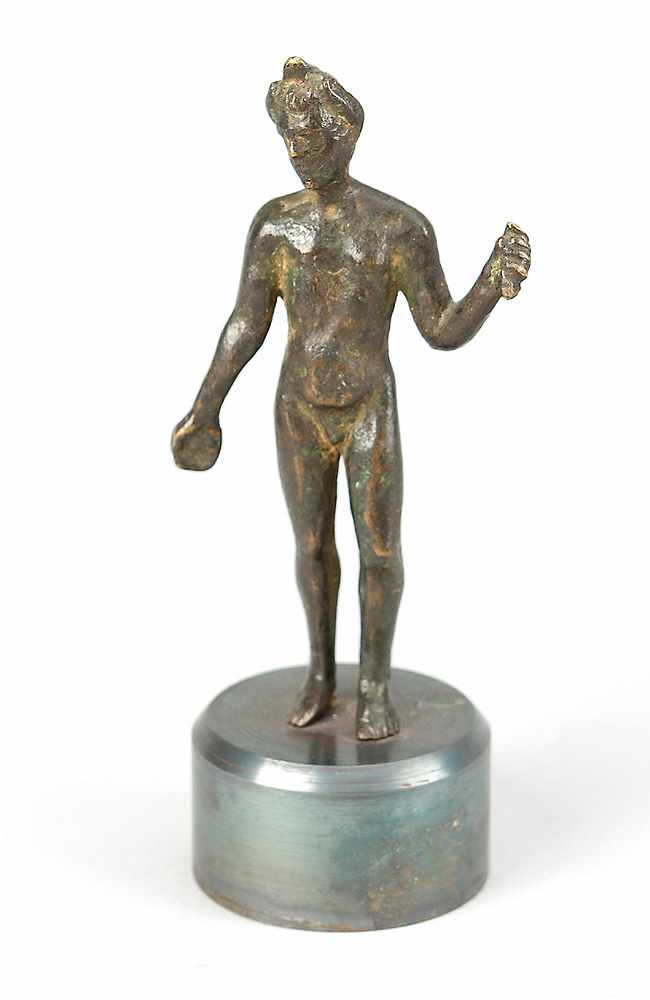 A Roman Bronze Statue, of a standing male nude, full bronze cast with original patina, on later