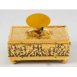 Singing Bird Box, in bronze gilded casket with ability to open, on top enameled lid picture, the box