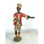 Sculpture of a Venetian Servant, terracotta on oval base of a black man in venetian baroque dress,