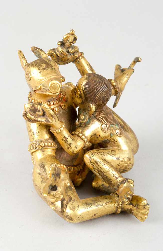 Indian erotic bronce sculpture, of a female and male godness with several objects in hands and the - Image 2 of 3