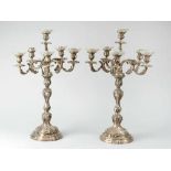Pair of large silver Candelabra, in Rococo style, round and waved stand, central column with