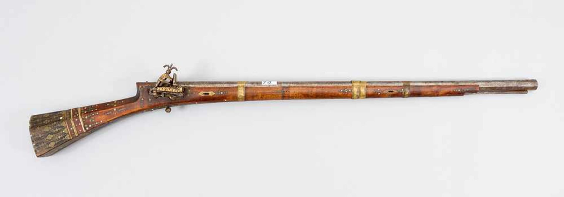 A Ottoman Riffle, wooden shaft with ornamental decorations in bronze, horn and wood. Iron filler and