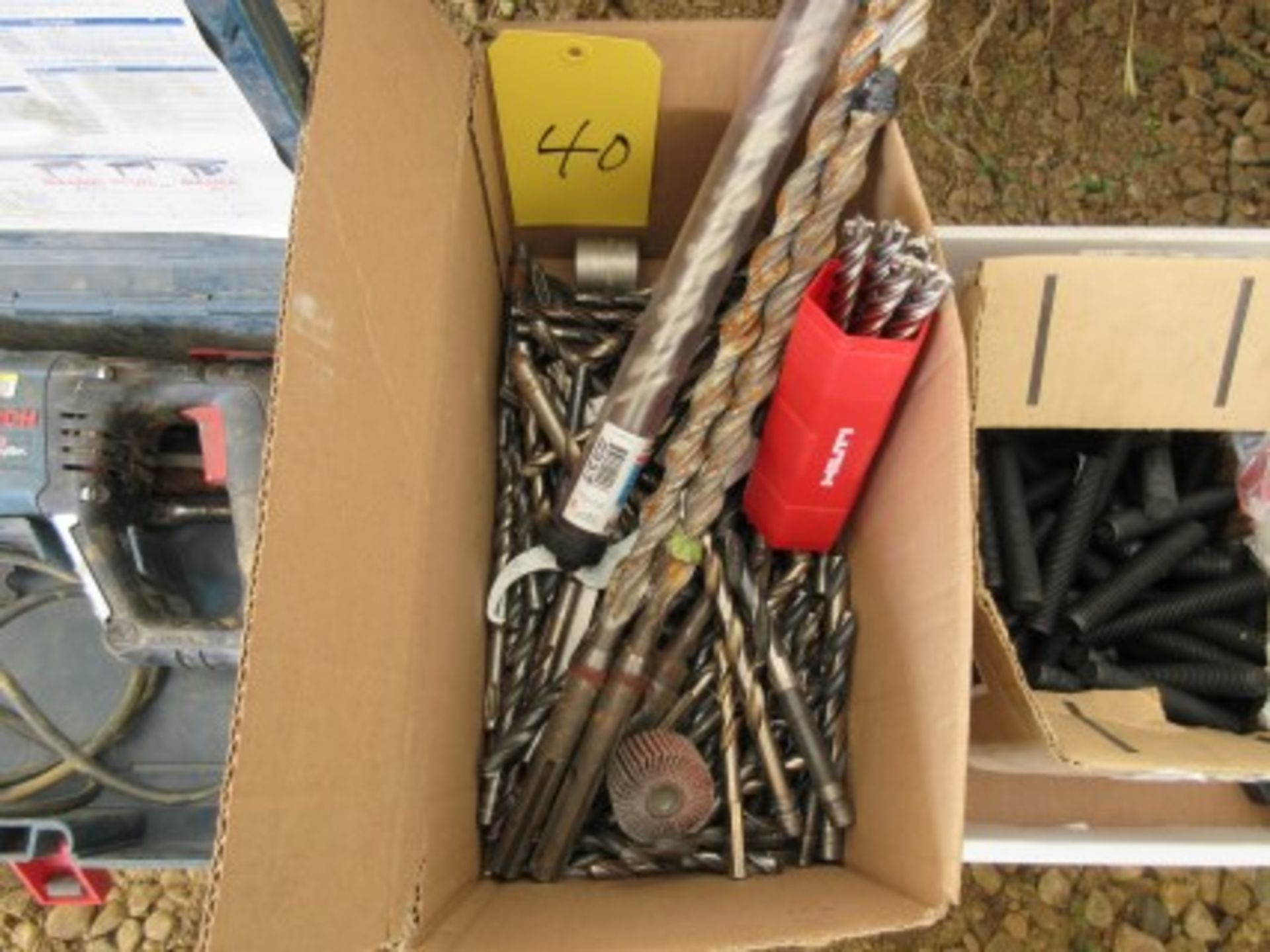 Box of metal bits and Hilti concrete bits