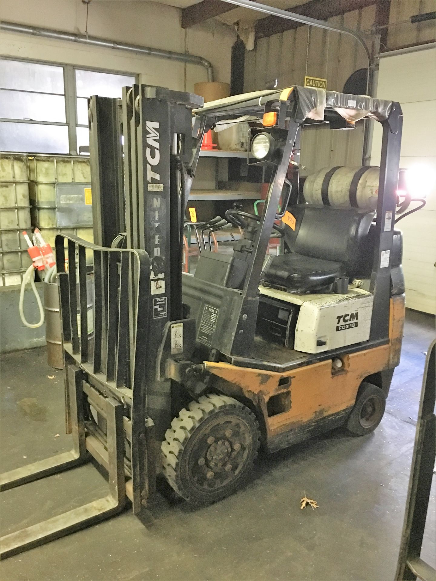 TCM # FCG-18 FORKLIFT WITH SOLID TIRES, PROPANE, TRIPLE MAST, 2,500 LB. CAPACITY, S/N A15WO1374