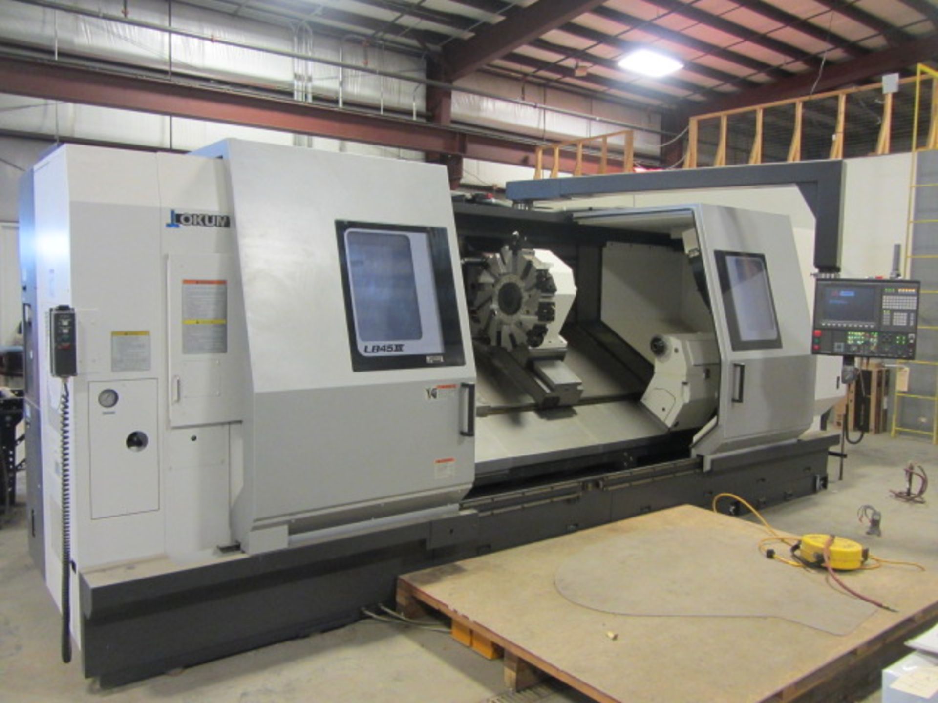 Okuma Model LB45II C2000 Hollow Spindle CNC Turning Center with Dual Front & Rear 24'' 4-Jaw Chucks,