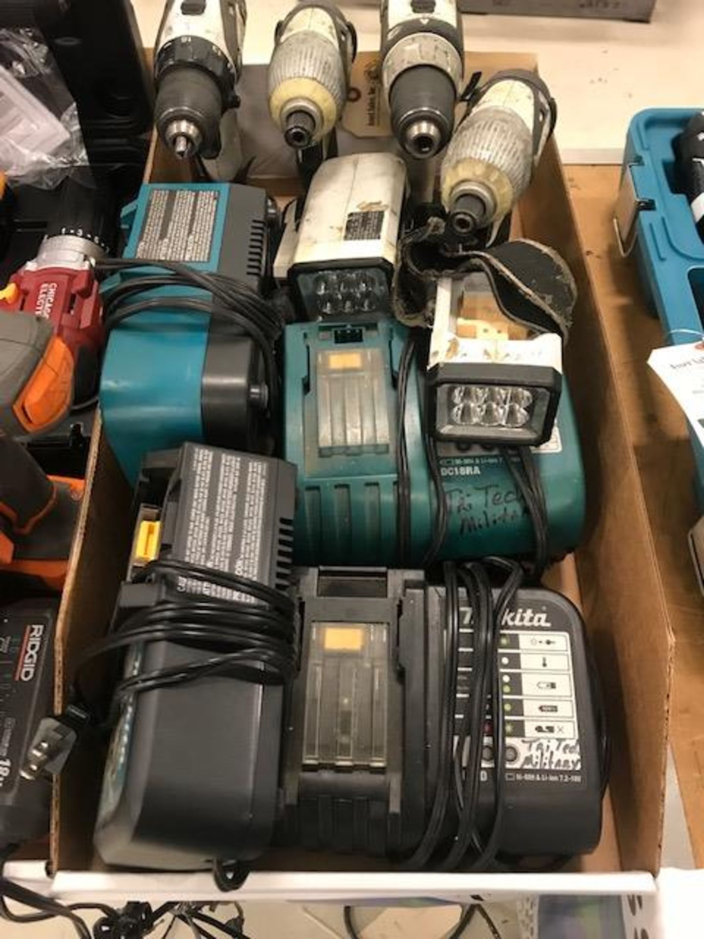 (4) Makita Drills, (3) Lights & Chargers (no batteries)