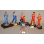 Five unboxed resin Racing Driver figurines including Jean Alesi and Michael Schumacher,