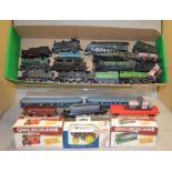 OO gauge. 12 x unboxed locomotives with a selection of rolling stock by Hornby and similar.