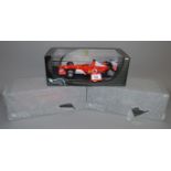 Three Hot Wheels Racing 1:18 scale diecast models: F2003-GA Rubens Barrichello;