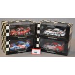 Minichamps. Four Porsche 911 GT3 RSR diecast model cars in 1:43 scale.