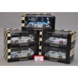 Minichamps. Five Audi R8 diecast model cars in 1:43 scale.