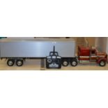 A large scale model of an American Semi Truck and Trailer appears to be in generally good condition