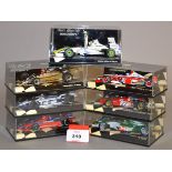 Minichamps. Seven diecast model Racing Cars in 1:43 scale including a Jaguar Racing R5 C.