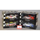 Minichamps. Four Porsche 911 GT3 RSR diecast model cars in 1:43 scale.