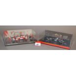 Minichamps. Two boxed 1:43 scale diorama model sets, McLaren Mercedes and Panasonic Toyota Racing.