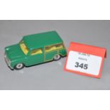 An unboxed Dinky Toys 197 Morris Mini Traveller with dark green body,