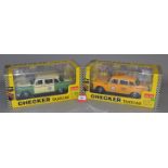 Two Sun Star 1:18 scale Checker Taxicabs: 1981 Chicago Checker Cab; 1981 Los Angeles Checker Cab.