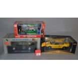 Three boxed diecast Taxi models, a 1:38 scale Carven R/C Toyota Hong Kong Taxi,