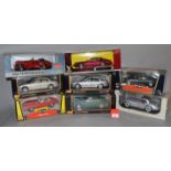 Eight boxed 1:18 scale Jaguar diecast model cars including three by Maisto, two by Bburago,