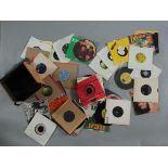 A small vintage box of 7 inch vinyl records (singles) including David Bowie, The Move,