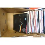 A box full of LP records including Pink Floyd - Dark Side of the Moon Re-issue, Wings, Blur,