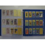 Cigarette card album including Typhoo, Godfrey Phillips, Kings of Coronation, Reign of George V,