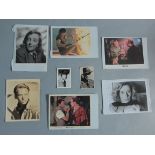 A collection of signed vintage photos & lobby cards for Actors & Actresses including Charlton