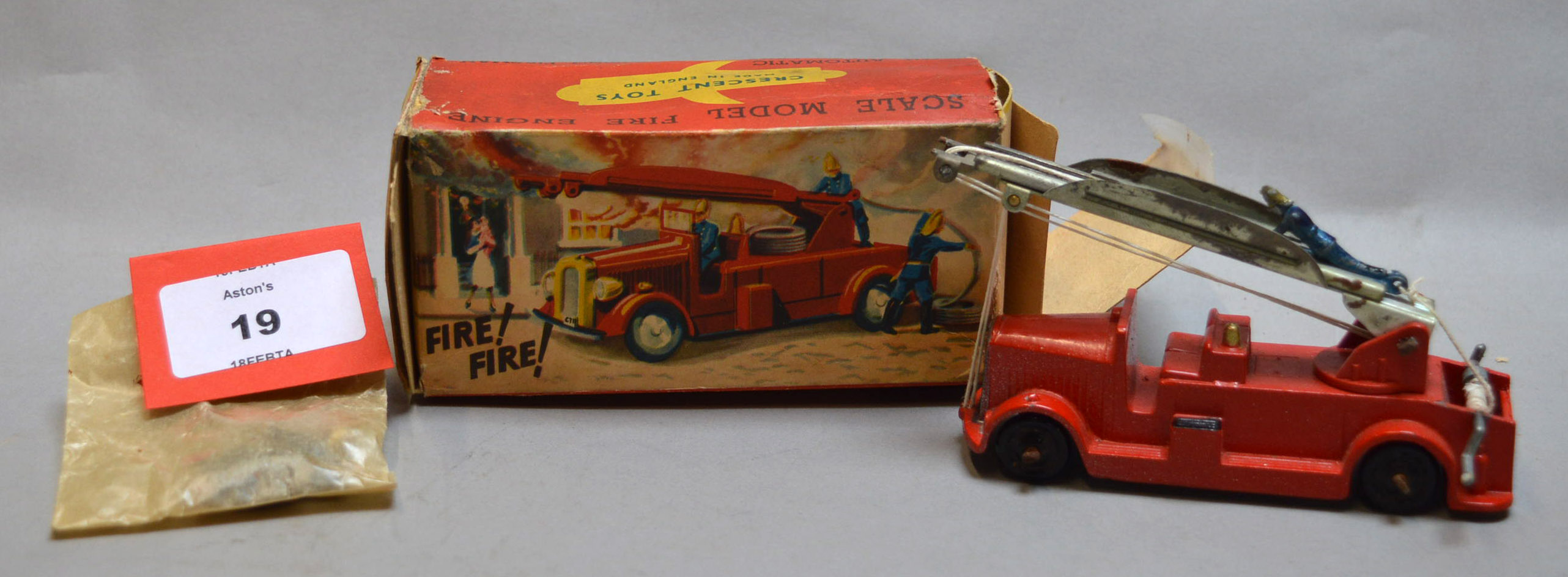 A boxed Crescent Toys diecast model #1221 Fire Engine with Extending Ladder and Climbing Fireman