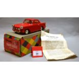 A boxed Tri-ang Minic M021 battery operated Triumph Herald plastic car model in 1:20 scale.