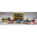 Four boxed Tri-ang Mini Hi-Way diecast models from their 'Racing Car' series,