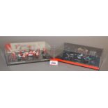 Minichamps. Two boxed 1:43 scale diorama model sets, McLaren Mercedes and Panasonic Toyota Racing.