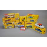 Twelve boxed Atlas Dinky Toys diecast model cars including 555 Ford Thunderbird,