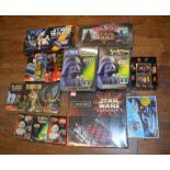 Three boxes of Star Wars games and puzzles, including a chess set, 3D puzzles, Rubik's Cube, etc.