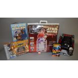 A very large quantity of assorted Star Wars merchandise, to include mugs, DVDs, videos,