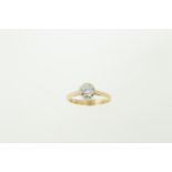 An 18ct H/M diamond solitaire ring, the round brilliant cut diamond approx 0.