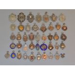 A quantity of approx 40 silver fob medals, football, shooting etc,