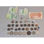 An assortment of coins and banknotes, to include silver crowns.