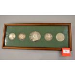 A framed collection of five silver Royal commemorative medallions, 1887 Jubilee 78mm,