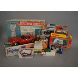 A mixed group of boxed toys including an Eldon Touch Command Remote Control Corvette Sting Ray,