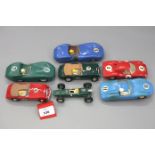 Seven slot cars: Scalextric Austin Healey 3000 in green, RN16; Scalextric Austin Healey 3000 in red,