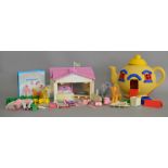 Hasbro My Little Pony, three figures with a house and other accessories.