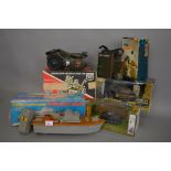 A mixed lot of boxed toys including a Cherilea German Army Motor Cycle, an ITT Combat Radio,