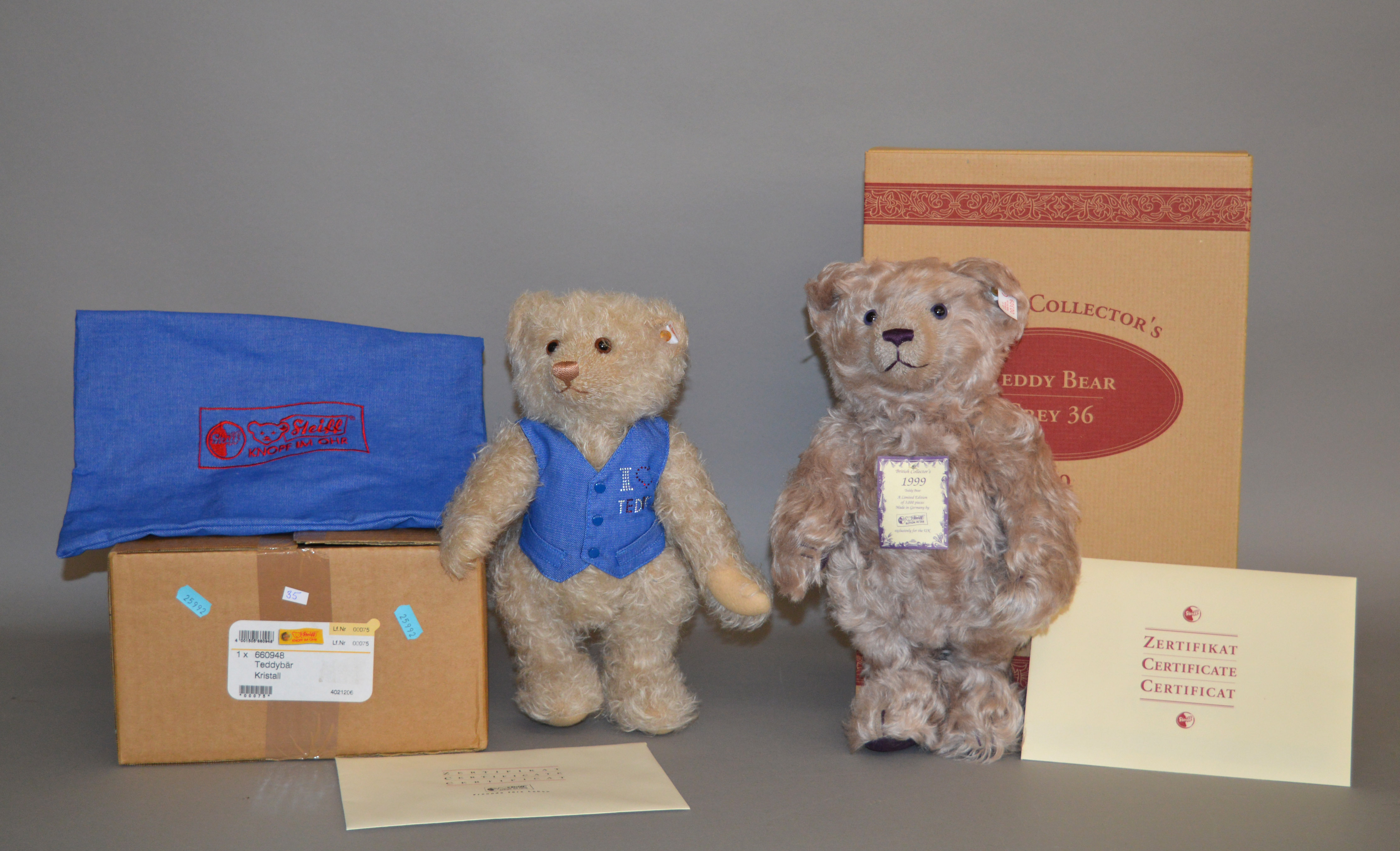 Two Steiff teddy bears: 660948 'Crystal' teddy bear in bag with outer carton; 660047 Grey 36,